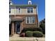 Charming brick-and-siding townhouse with a covered entrance and well-maintained landscaping at 8410 Scotney Bluff Ave, Charlotte, NC 28273