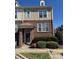 Charming brick-and-siding townhouse with a covered entrance and well-maintained landscaping at 8410 Scotney Bluff Ave, Charlotte, NC 28273