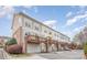 Exterior view of townhomes featuring decks, and attached garages at 8410 Scotney Bluff Ave, Charlotte, NC 28273