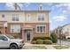 Charming townhome featuring brick facade, well-maintained landscaping, and a covered entryway at 8410 Scotney Bluff Ave, Charlotte, NC 28273