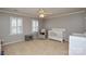 Spacious Bedroom with neutral walls, white trim, and a large window, perfect for a haven at 916 Somersby Ln, Matthews, NC 28105