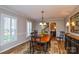 Elegant dining room with hardwood floors, a large dining table, and classic decor at 916 Somersby Ln, Matthews, NC 28105