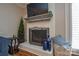 Close-up of the living room fireplace with decorative accessories and a TV at 916 Somersby Ln, Matthews, NC 28105