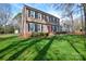 Traditional two-story home with a green lawn and classic black shutters, showcasing a well-maintained exterior at 916 Somersby Ln, Matthews, NC 28105