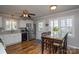 Eat-in kitchen features stainless steel appliances, white cabinets, and a wood table at 916 Somersby Ln, Matthews, NC 28105