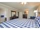 Comfortable main bedroom with dark wood furniture and ensuite bathroom at 916 Somersby Ln, Matthews, NC 28105