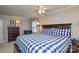 Comfortable main bedroom with a bed, shuttered windows and dark wood dresser at 916 Somersby Ln, Matthews, NC 28105