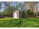 Storage shed in the backyard, providing convenient space for tools and equipment at 916 Somersby Ln, Matthews, NC 28105