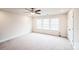 Bedroom featuring neutral carpet, a ceiling fan, and a large window for plenty of natural light at 9300 Vecchio Dr, Indian Land, SC 29707