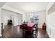 Bright dining room featuring dark hardwood floors, white trim and a large window providing natural light at 9300 Vecchio Dr, Indian Land, SC 29707