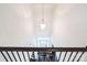 Bright foyer with a decorative pendant light, high ceilings, and entry door with transom windows at 9300 Vecchio Dr, Indian Land, SC 29707