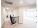 Upstairs hallway featuring neutral carpet, an open doorway, and black railings with white trim at 9300 Vecchio Dr, Indian Land, SC 29707