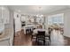 Kitchen with granite countertops, stainless steel appliances, kitchen island, breakfast nook and adjacent sunroom at 9300 Vecchio Dr, Indian Land, SC 29707