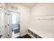 Bright mudroom features built-in bench with cubbies and wall hooks at 9300 Vecchio Dr, Indian Land, SC 29707