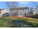 Spacious backyard featuring a patio, green lawn, and wooden fence, perfect for outdoor entertaining at 1009 Rocky Meadows Ln, Concord, NC 28025