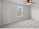 Bedroom with neutral carpet, window view and ceiling fan at 1009 Rocky Meadows Ln, Concord, NC 28025