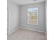 Neutral bedroom with a window and carpeted flooring, offering a blank canvas for personalization and comfort at 1009 Rocky Meadows Ln, Concord, NC 28025