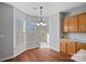 Sunlit breakfast nook featuring large windows and a cozy dining area, perfect for enjoying morning meals at 1009 Rocky Meadows Ln, Concord, NC 28025