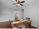 Cozy dining area featuring hardwood floors and a ceiling fan with views through to the kitchen at 1009 Rocky Meadows Ln, Concord, NC 28025