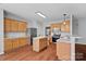 Spacious kitchen with stainless steel appliances, wooden cabinets, and island providing great functionality and storage at 1009 Rocky Meadows Ln, Concord, NC 28025