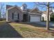 Inviting brick home showcases a well-kept lawn, two-car garage, and an attractive entryway, creating a welcoming curb appeal at 116 Paradise Hills Cir, Mooresville, NC 28115