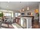 Bright, open-concept showcases a kitchen island, dining area, and living space with lots of natural light at 116 Paradise Hills Cir, Mooresville, NC 28115