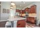 Open kitchen design with a central island, pendant lights, stainless steel appliances, and ample counter space at 116 Paradise Hills Cir, Mooresville, NC 28115