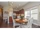 Eat-in kitchen featuring wooden cabinets, stainless steel appliances, and adjacent dining area with round table at 116 Paradise Hills Cir, Mooresville, NC 28115