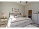 Sunlit bedroom with a king-sized bed, bedside tables, and access to an ensuite bathroom at 116 Paradise Hills Cir, Mooresville, NC 28115