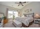 Comfortable bedroom with a king-sized bed, a neutral color palette, and vaulted ceilings at 116 Paradise Hills Cir, Mooresville, NC 28115