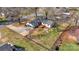 Charming home seen from above featuring a fenced backyard, complemented by mature trees and manicured lawns at 1206 9Th Nw St, Hickory, NC 28601