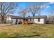 Expansive backyard showcasing a wooden deck, fenced perimeter, and well-maintained lawn, perfect for outdoor living at 1206 9Th Nw St, Hickory, NC 28601