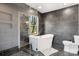 Sleek bathroom featuring a large tub, black tiled walls, and a large window providing natural light at 1206 9Th Nw St, Hickory, NC 28601