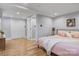 Comfortable bedroom with a pink bed, modern decor, and ample closet space at 1206 9Th Nw St, Hickory, NC 28601