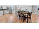 Dining area with table set for six, seamlessly connected to a modern, white kitchen at 1206 9Th Nw St, Hickory, NC 28601