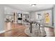 Sunlit dining area adjacent to the living room features hardwood floors and access to outdoor patio at 1206 9Th Nw St, Hickory, NC 28601