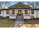 Stunning exterior showcasing the front porch with its unique wooden beams and sleek black accents at 1206 9Th Nw St, Hickory, NC 28601