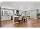 Bright, open kitchen with modern appliances, white cabinets, a wood-accented island, and eat in dining space at 1206 9Th Nw St, Hickory, NC 28601
