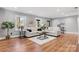 Bright living room featuring hardwood floors, neutral walls, and stylish furniture arrangement at 1206 9Th Nw St, Hickory, NC 28601