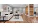 Living room featuring hardwood floors, neutral paint colors, a cozy seating area, and a wood accent wall at 1206 9Th Nw St, Hickory, NC 28601