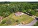 Expansive aerial view of a charming house with a large lawn, surrounded by lush greenery and trees at 1226 Flint Ct, Matthews, NC 28104