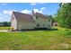 Spacious backyard with a well-maintained lawn and a charming wooden deck at 1226 Flint Ct, Matthews, NC 28104
