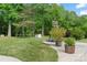 Spacious backyard features a basketball hoop, trampoline, and lush greenery at 1226 Flint Ct, Matthews, NC 28104