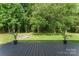 Inviting backyard deck with planters, offering a serene outdoor space at 1226 Flint Ct, Matthews, NC 28104