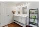 Bright bathroom features dual sinks with marble countertops, and sleek fixtures at 1226 Flint Ct, Matthews, NC 28104