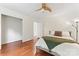 Bright bedroom featuring hardwood floors and an adjacent closet and ensuite bathroom at 1226 Flint Ct, Matthews, NC 28104