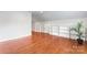 Spacious bonus room featuring hardwood floors, recessed lighting and built in shelves at 1226 Flint Ct, Matthews, NC 28104