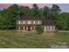 Charming two-story home with a covered porch, surrounded by mature trees at 1226 Flint Ct, Matthews, NC 28104