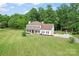 Stunning two-story home with a lush green lawn and mature trees at 1226 Flint Ct, Matthews, NC 28104