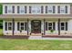 Charming front porch featuring decorative columns and a welcoming entrance at 1226 Flint Ct, Matthews, NC 28104